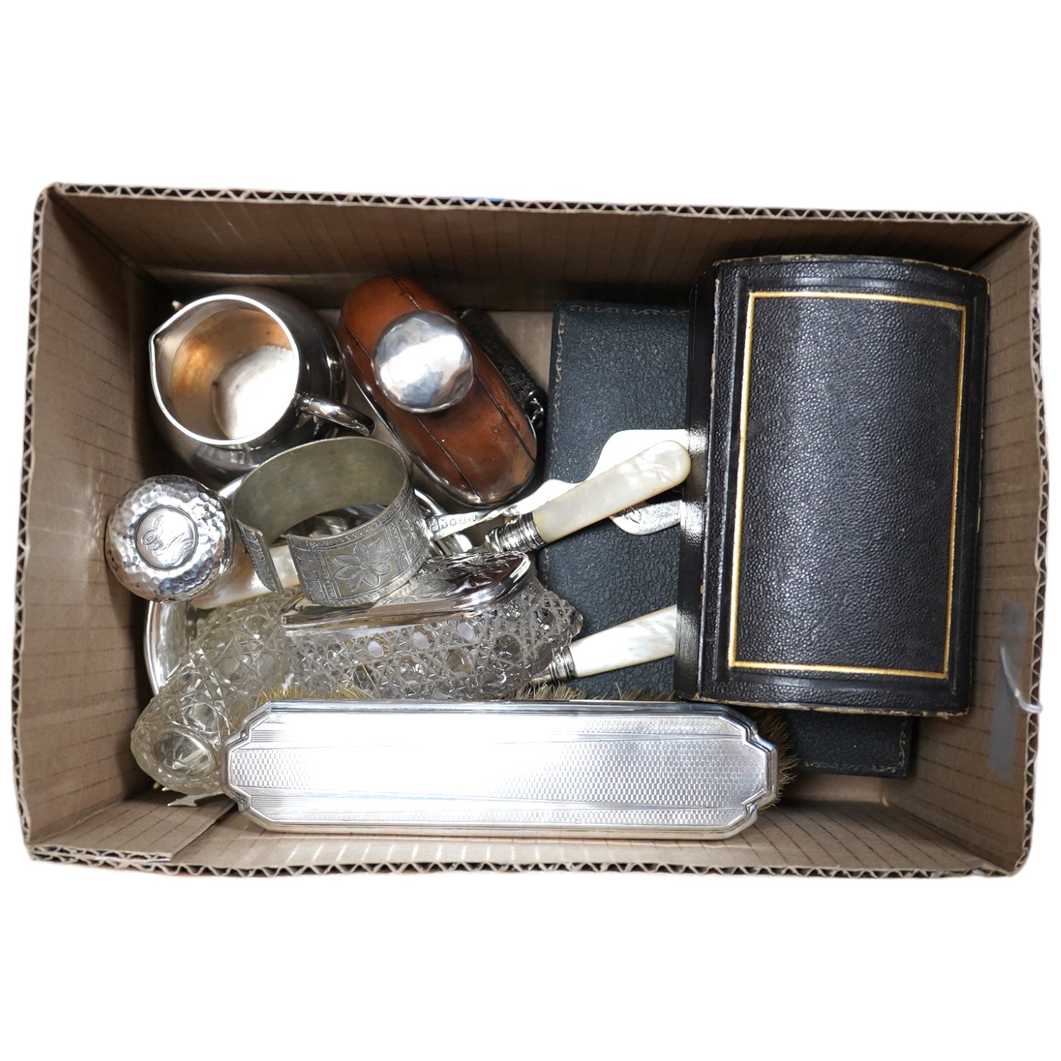 Sundry small silver including an Edwardian bowl and cream jug, a cased pair of Victorian napkin rings, a cased christening pair, a cigarette holder case, thimble and five dressing table items, together with seven plated